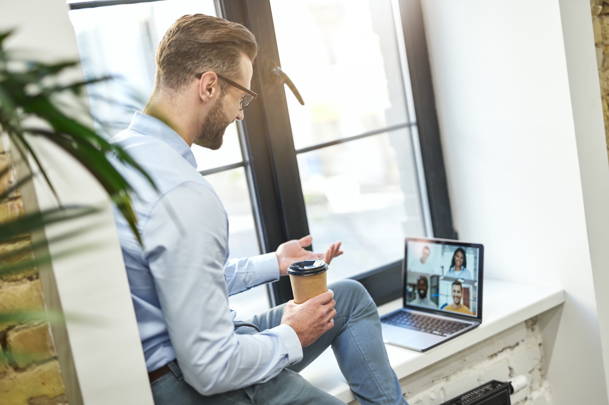 Friendly online conversation with coworkers in comfortable place