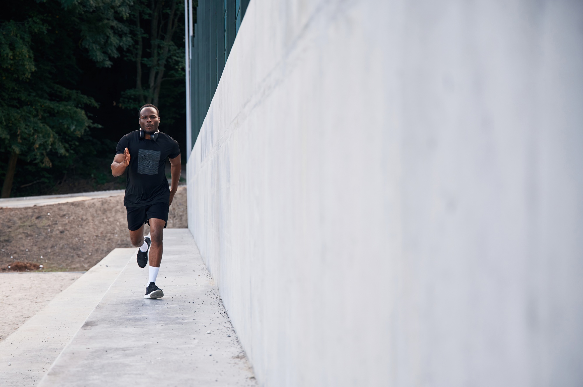 Sportive black man is running, morning routine